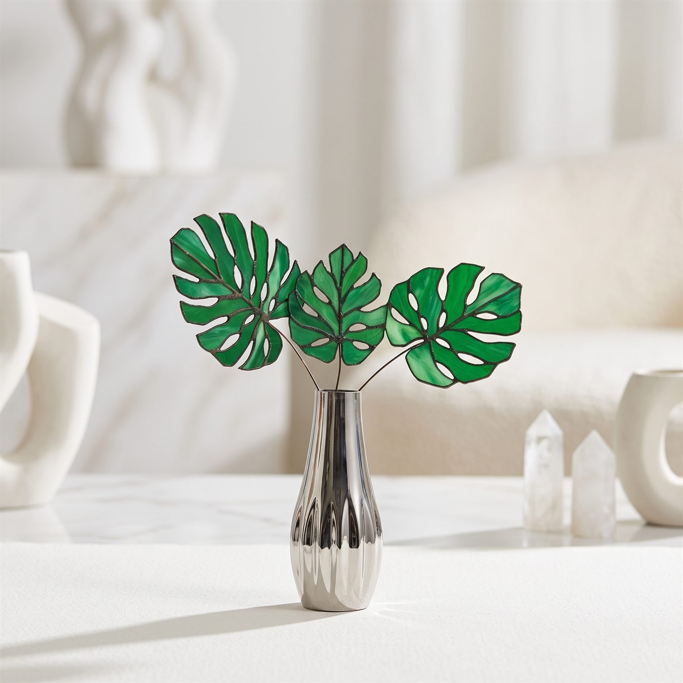 Studio hero shot – Stained-glass monstera leaves · silver vase